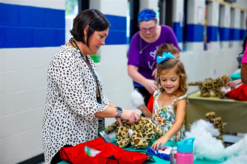 Students build a cheetah at a community event